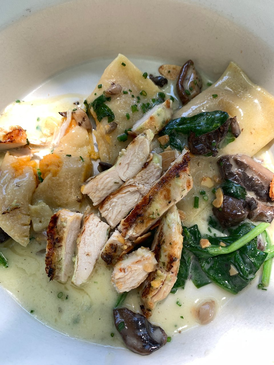 Olive & Ivy signature dishes Bacon Wrapped DatesPesto Chicken FlatbreadSweet Potato Cannelloni